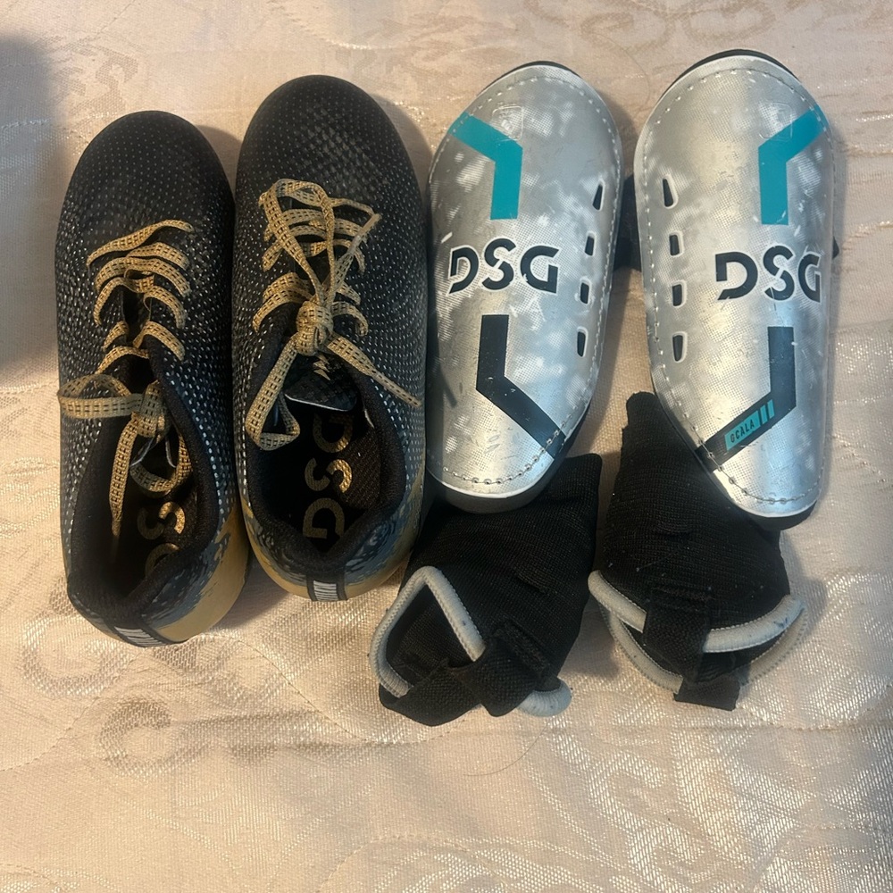 Boys size 1 soccer cleats and shin guards